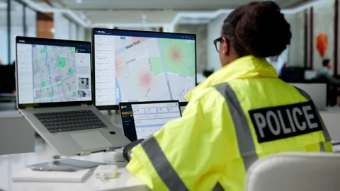 Police Analyst Studies Crime Data Patterns Using GIS Software Stock Footage 344719153