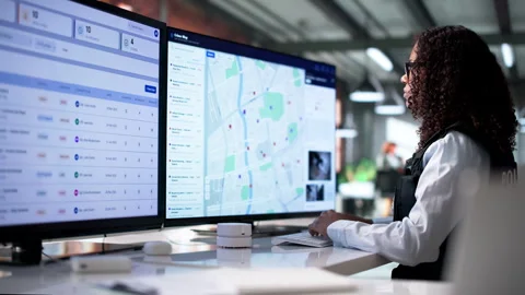 Police Analyst Studies Crime Maps Using Geospatial Software Vídeo Stock 341011712