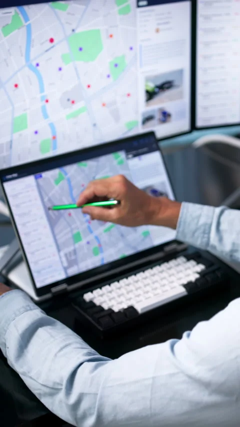 Police Analyst Studies Crime Maps On Laptop Stock Footage 343884320