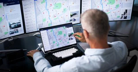 Police Analyst Studies Crime Patterns On Laptop, Improving Urban Safety Strat Stock Photos