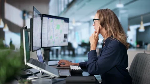 Police Analyst Studying Crime Patterns Using Geospatial Mapping Software Stock Footage 345854499