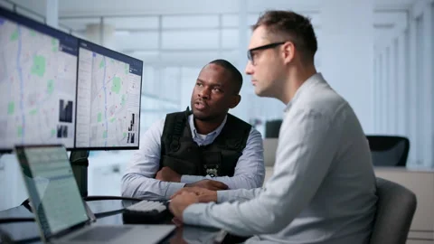 Police Analysts Study Crime Patterns Using Geospatial Mapping Software Stock Footage 346321023