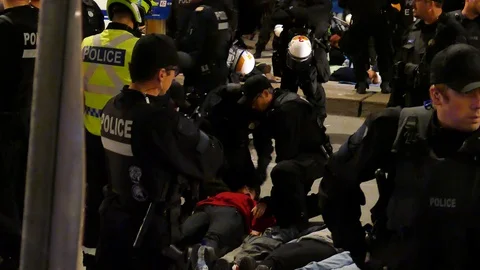 Police arresting non-violent protester Stock Footage 120090249