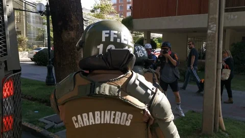 The police arresting one protester during latest riots in Santiago city Video stock 119702012