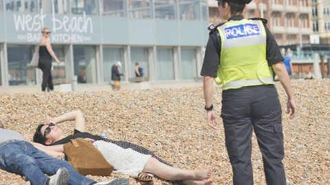 Police on the beach 1 Stock Footage 130036350