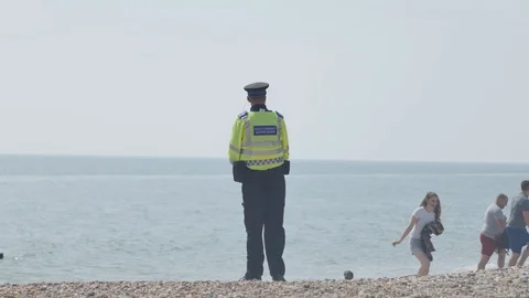 Police on the beach 5 Stock Footage 130061517
