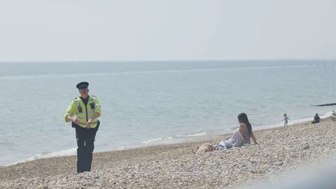 Police on the beach 7 Stock Footage 130059569