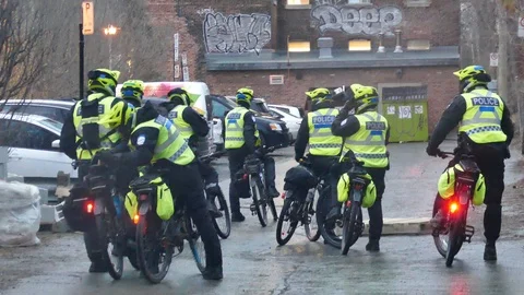 Police on bicyle in allay Stock Footage 114763367