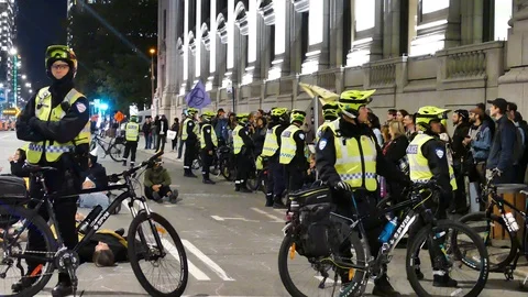Police blocking people from the sidewalk Stock Footage 120061896