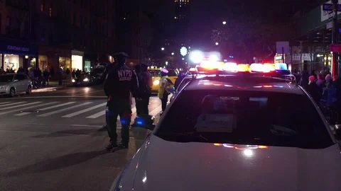 Police blocking streets during Macys parade balloon evening inflation NYC 4k Stock-Footage 86339774
