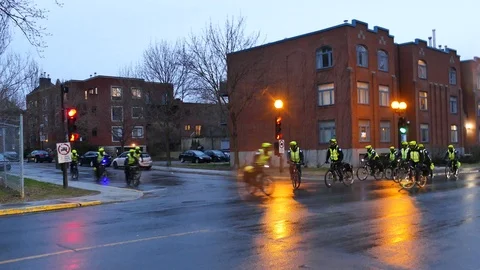 Police on bycicle speedly passing Stock Footage 114763769
