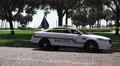 Police Car On Brick Road Crash Wreckage Of A Small Plane 4K 4k or 4k+ Resolution