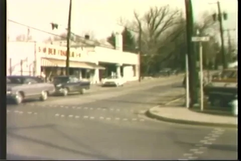 Police car chase the stolen car on street - 1975 Stock Footage