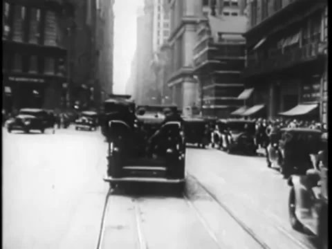 Police car chase through New York City streets, 1930s Stock Footage