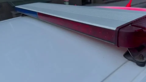 A police car flashes red and blue lights Stock Footage 249772001