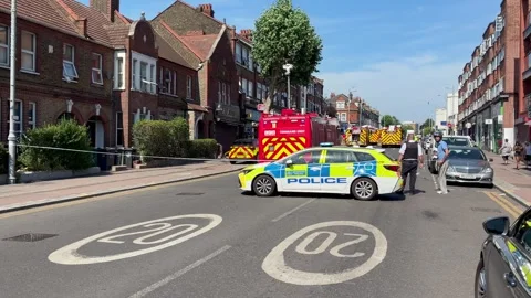 A Police Car Forms A Cordon As Firefighters Attend A Fire Above A Parade Of Stock-Footage 342306789