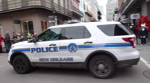 Police Car going through intersection during Mardi Gras 스톡 동영상 52372816