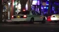 Police Car At Night With Flashing Lights On City Street HD HD Footage
