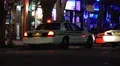 Police Car At Night With Flashing Lights On City Street 4K 4k or 4k+ Resolution
