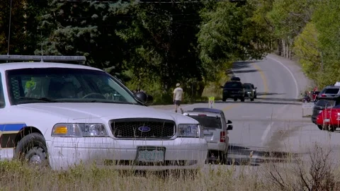 Police Car Parked By Highway in Small Town, Real or Fake Cop? Stock Footage 161128853