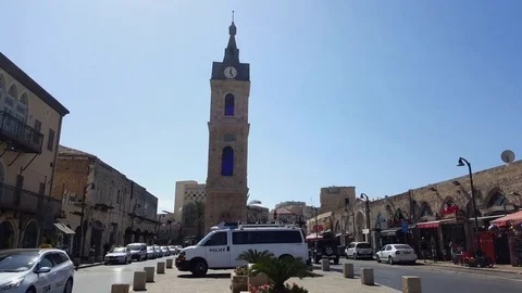 Police car parked at Jaffa clock tower, Muazin audio, street, cars, road, sunny Vídeos de archivo 80732296