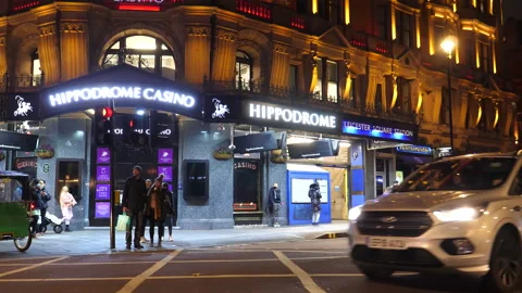 Police car passing Hippodrome casino in London Stock Footage