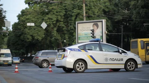 A police car patrolling the city during the Euro 2016 in Ukraine Stock Footage 64478853