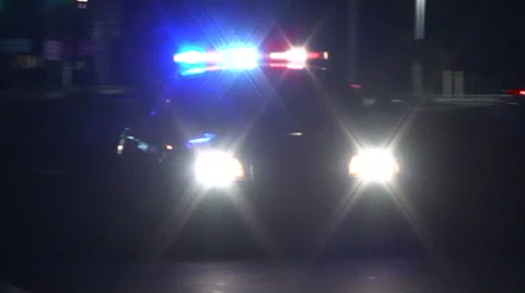 Police car responding with lights, no siren Stock Footage