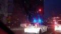 Police car standing in road traffic, keeping order around and patrolling city HD Footage