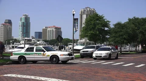 Police Cars And Officer On Brick Road Tampa Bay Marina And City Skyline 4K Stock Footage