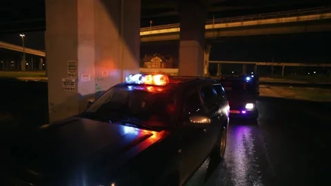 Police cars in high speed pursuit. Stock Footage