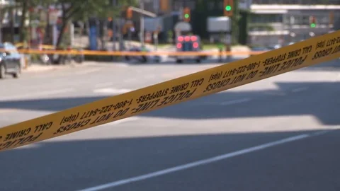 Police cars at roadblock in city street Stock Footage