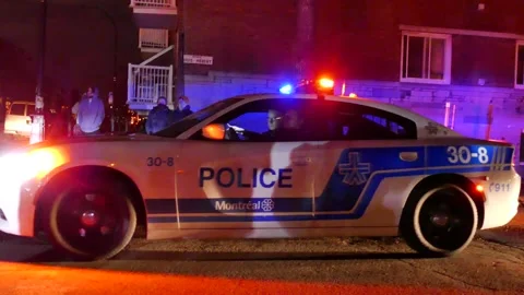 Police Charger slowing down in front of cameraman Stock Footage 139664293