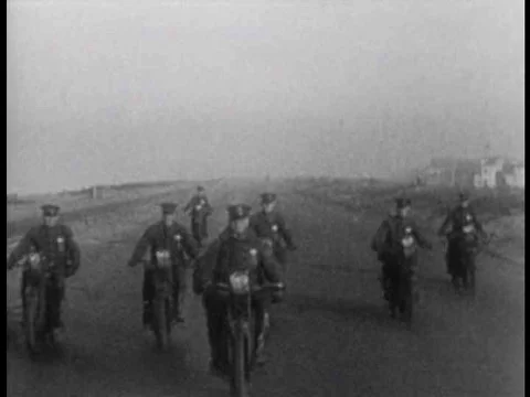 Police chase a vehicle and hop aboard, abandoning their motorcycles in this Stock Footage