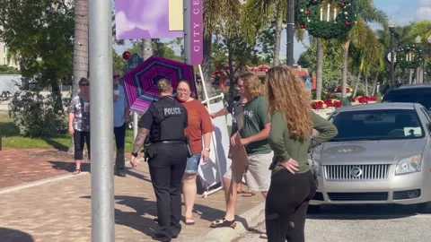 Police chasing off protestor Stock Footage 168906250