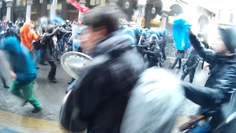 Police clashes and demonstrators in the May Day procession Stock Footage 88965393