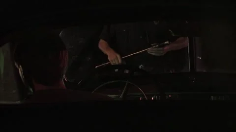 Police conduct night stop in front of vehicle Stock Footage 300114484