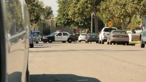 Police cruiser driving by Stock Footage 10899195