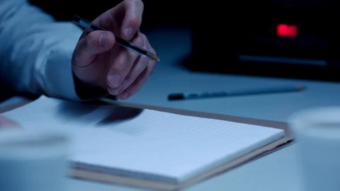 Police Custody Interrogation Interview Room - Detective Fidgets with Pen 動画素材 114796828