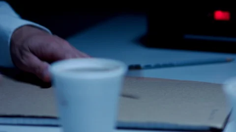 Police Custody Interrogation Interview Room - Detective Handling Coffee Cup 動画素材 114796914