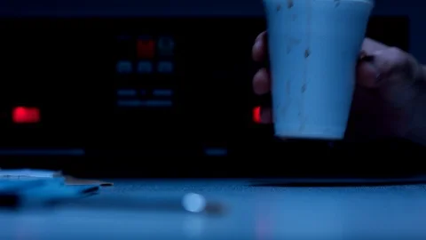 Police Custody Interrogation Interview Room - Suspect Picks up Coffee Cup Stock Footage 114798559