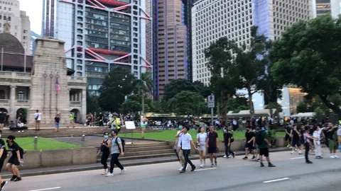 Police decide to end the assembly early and deploy. Peaceful protesters panic. Stock Footage 115707177