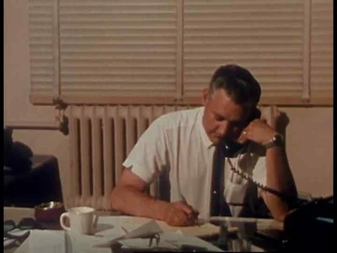A police detective pulls a file in his office and it shows a picture of a man Video stock 75277156