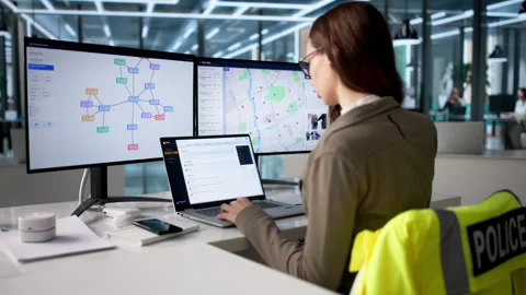Police Detective Uses Computer Software Stock Footage 334531870