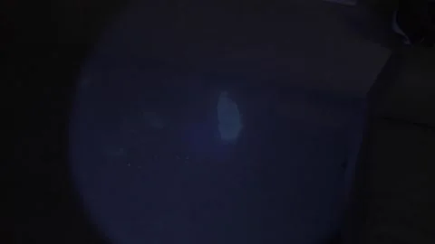 Police detective using a black light to search for clues Stock-Footage 304293608