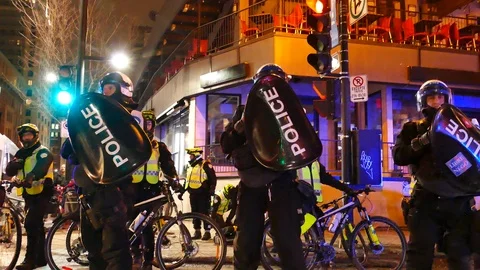 Police during protest with shield Stock Footage 105354903
