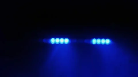 Police emergency strobe lights flashing blue and red in dark foggy night ba.. Stock Footage 334641512