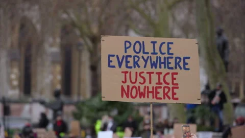 "Police everywhere justice nowhere" protest placard, Sarah Everard vigil London Stock Footage