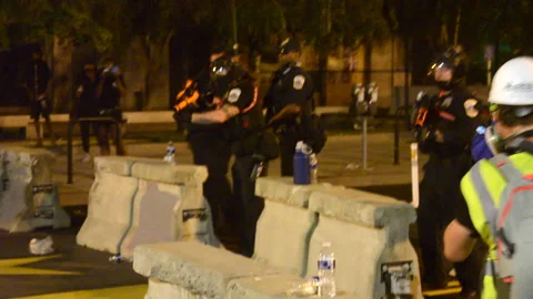 Police fire rubber bullets at "Black Lives Matter Plaza" in Washington DC Stock Footage 138462238