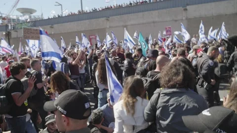 Police forces confront protesters blocking main highway during violent protest Stock Footage 236204353